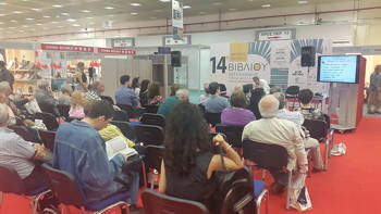 A seated audience watches a presentation at the 14th International Book Fair in Thessaloniki